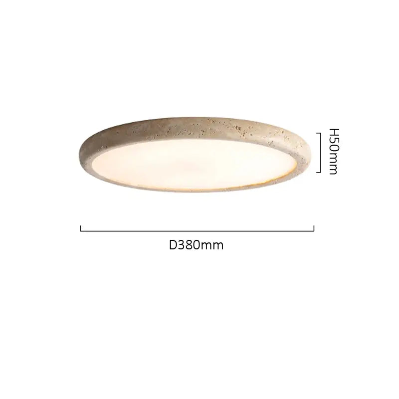 Beige concrete brass led flush mount ceiling lamp with textured finish and softly glowing illuminated center for living room