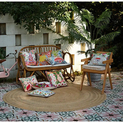 Beige egret bird pattern pillow case on colorful cushions of woven rattan garden bench for living room sofa