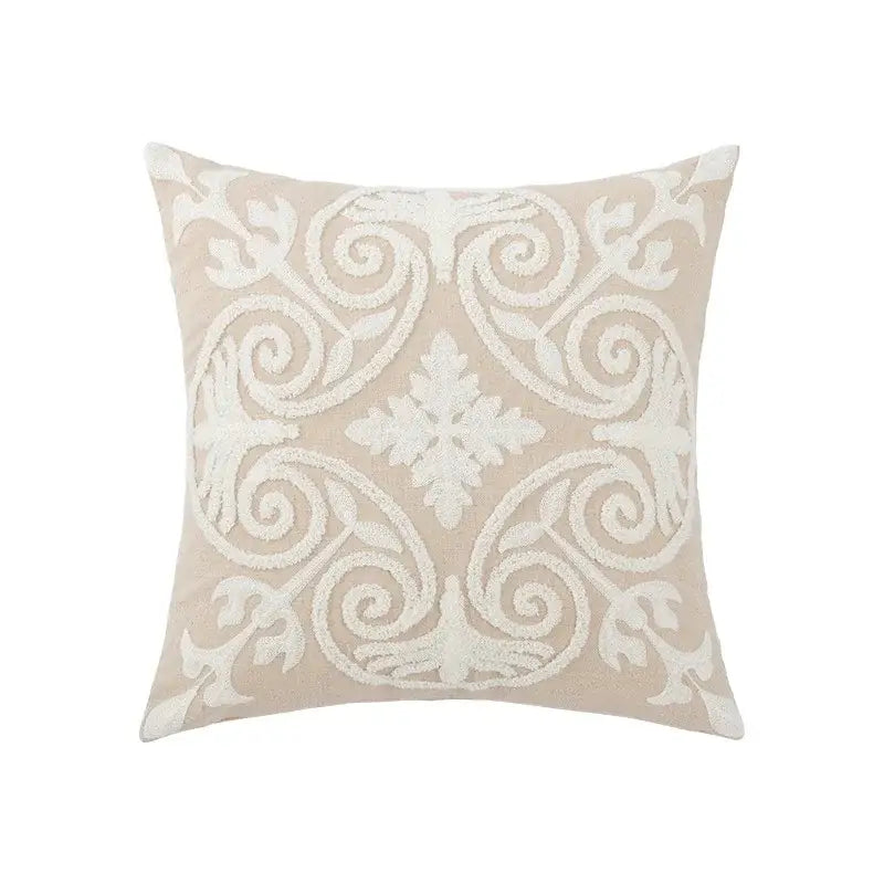 Beige square pillow cover with intricate white embroidered daisy floral and scrollwork design for bedroom decor