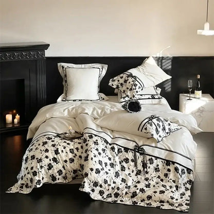 Beige floral satin cotton patchwork bedding set featuring white bedding with black floral patterns and elegant trim