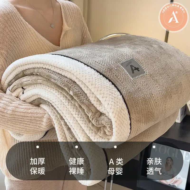 Beige and gray luxury velvet plush cotton blanket bedroom throw with soft textured surface and embroidered logo patch