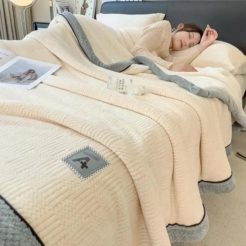 Beige and gray luxury velvet plush cotton blanket with quilted texture and branded patch for bedroom throw use