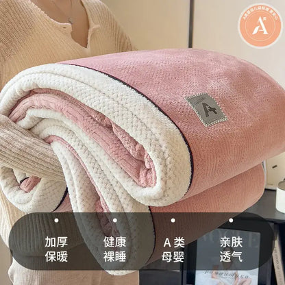 A double-sided luxury velvet plush cotton blanket with soft pink exterior and cream interior for bedroom throw use