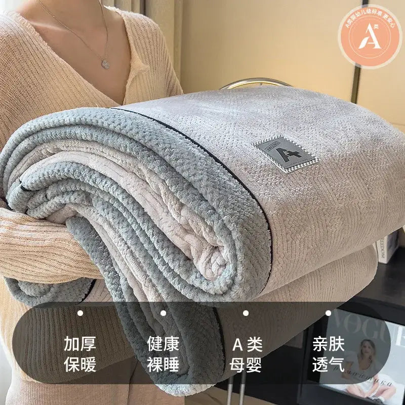 Beige and gray luxury velvet plush cotton blanket with double-sided fleece and embroidered logo patch for bedroom throw