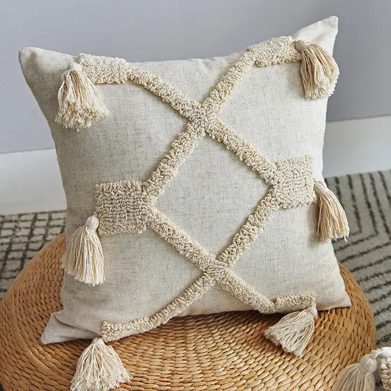 Beige linen pillowcase set with cream-colored woven tassels forming a cross pattern decorbites handmade geometric tufted design