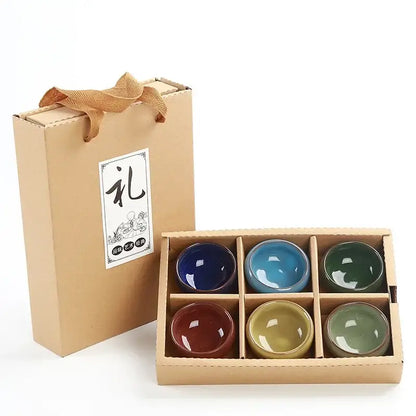 Set of six beige ice cracking ceramic tea cups in vibrant glazes inside a kraft gift box with woven handle decorbites ice cracking