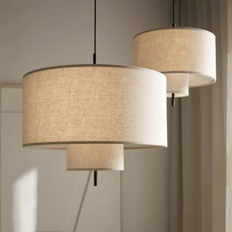 Beige linen handmade fabric chandelier with tiered drum pendant lights and black metal rods by decorbites handmade fabric