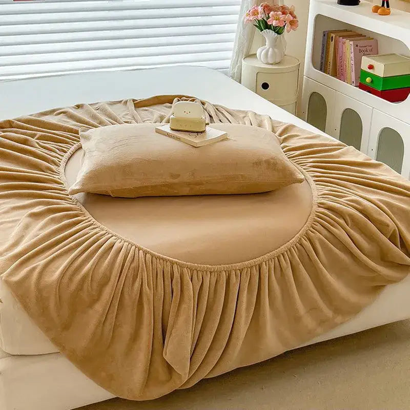 Beige velvet fitted sheet with ruffled edge and elasticized hem for a plush milk velvet fitted mattress topper