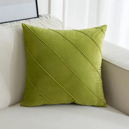 A square lime green velvet pillow with diagonal stitched lines featuring hand pleat embroidered design for living room use