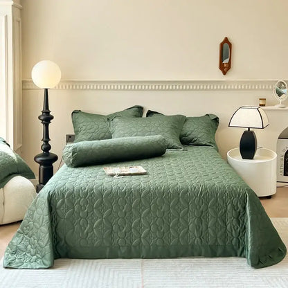 Emerald green quilted eucalyptus fiber bedspread with subtle floral pattern and matching pillows from decorbites eucalyptus fiber collection