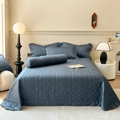 Navy blue quilted eucalyptus fiber bedspread with subtle wave pattern and ruffled edges for decorbites eucalyptus fiber decor