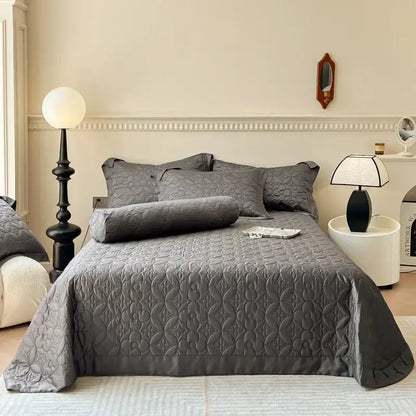 Gray quilted eucalyptus fiber bedspread with subtle floral pattern and ruffled edges for decorbites eucalyptus fiber decor