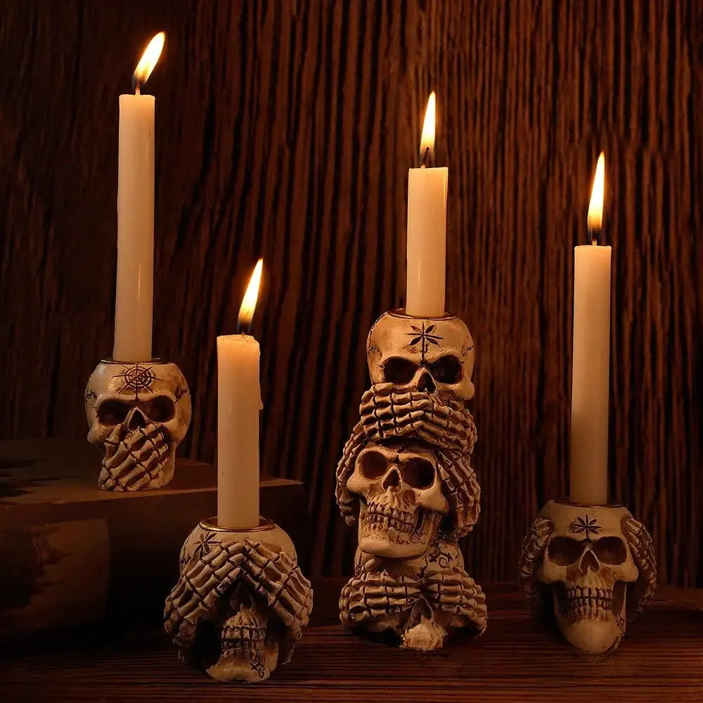 Set of three beige resin bone skeleton candlestick holders with intricate hand-drawn designs for dining room decorbites bone skeleton decor