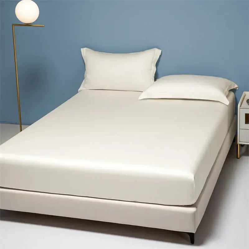 Cream-colored fitted sheet with smooth texture and subtle sheen made of decorbites 1000tc egyptian cotton