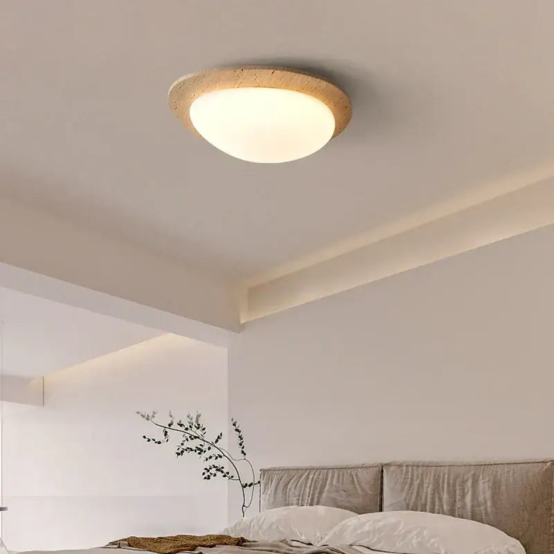 Beige speckled stone led ceiling light with warm diffused glow and natural stone outer ring for bedroom decorbites led ceiling
