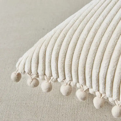 Beige striped corduroy cushion cover with cream-colored fabric and soft pom pom trim for living room decorbites decor