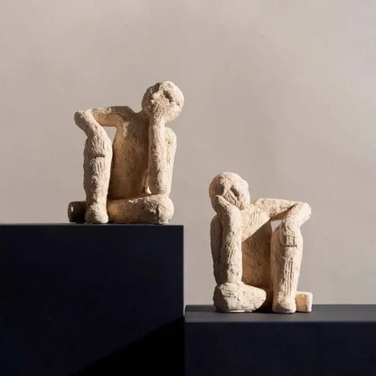 Two beige textured abstract resin figurine sculptures depicting human forms for living room decorbites decor