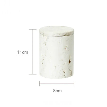 White textured cylindrical jar with lid featuring beige travertine marble stone-like finish from decorbites bathroom set