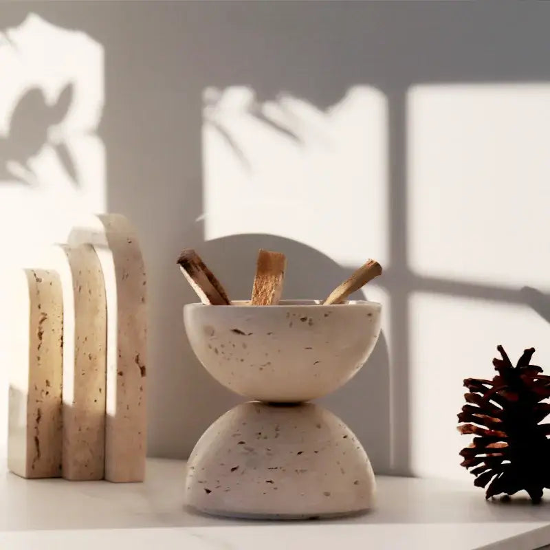 Cream-colored speckled stone bowl incense burner with stacked design holding wooden sticks for decorbites beige travertine decor