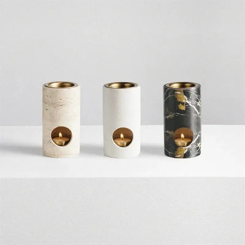 Beige travertine stone essential oil burner tray with three cylindrical gold interior candle holders for oil burner diffuser