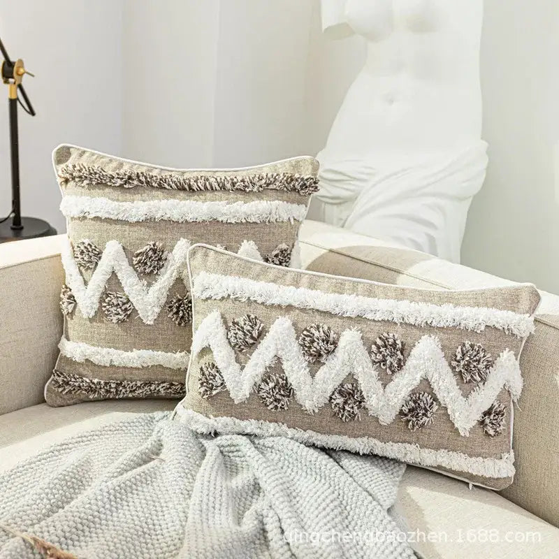 Beige rectangular cushion cover with diamond tufted zigzag embroidery fringe and pom-pom accents for living room decor
