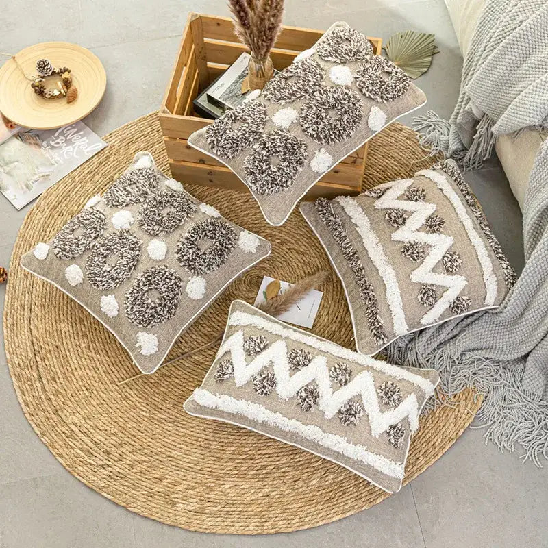 Set of four beige and white cushion covers with diamond tufted zigzag chunky knit patterns for living room decor