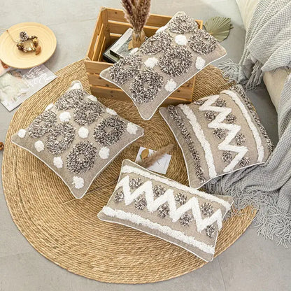 Set of four beige and white cushion covers with diamond tufted zigzag chunky knit patterns for living room decor