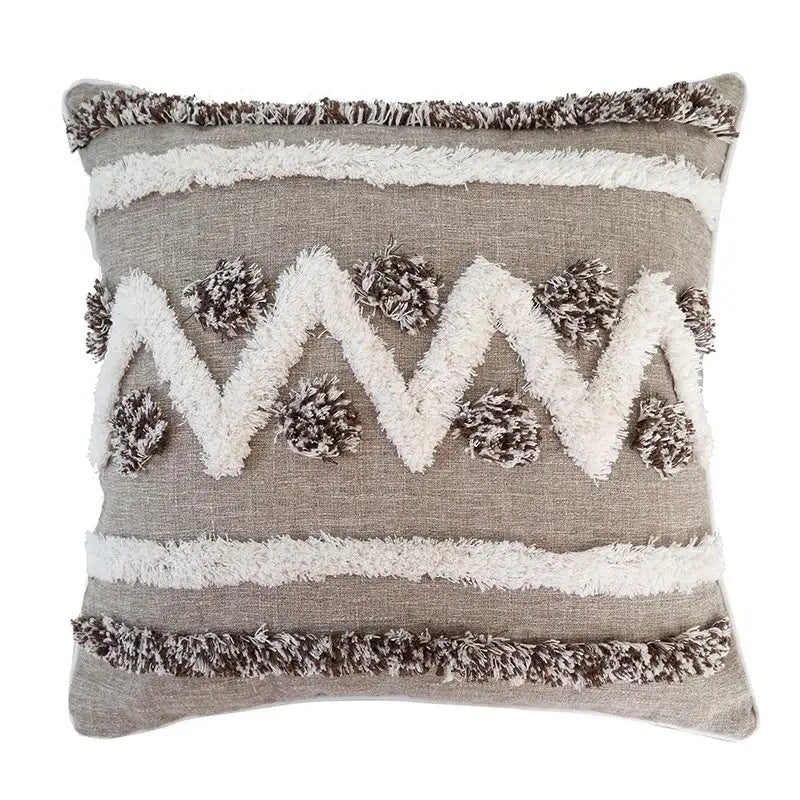Beige and white diamond tufted zigzag cushion cover with gray and white textured fabric and fringe trim for living room decor