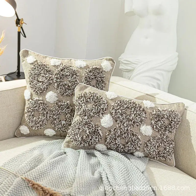 Beige and white cushion cover with diamond tufted zigzag pattern and textured fluffy circular designs for living room decor