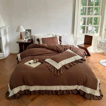 Beige and white lace ruffles bedding set with brown ruffled duvet cover and cream lace trim for bedroom use