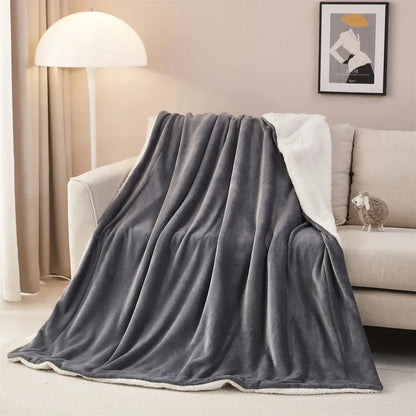 Gray plush throw blanket with soft textured exterior and white sherpa lining perfect for decorbites cozy sherpa use
