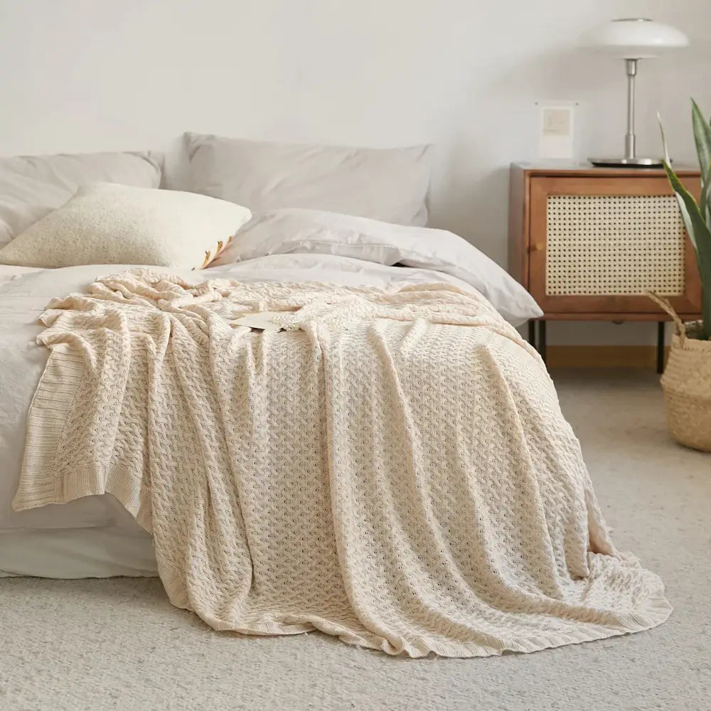 Cream-colored textured knit bamboo throw blanket with cozy woven pattern for decorbites cool summer air conditioning use