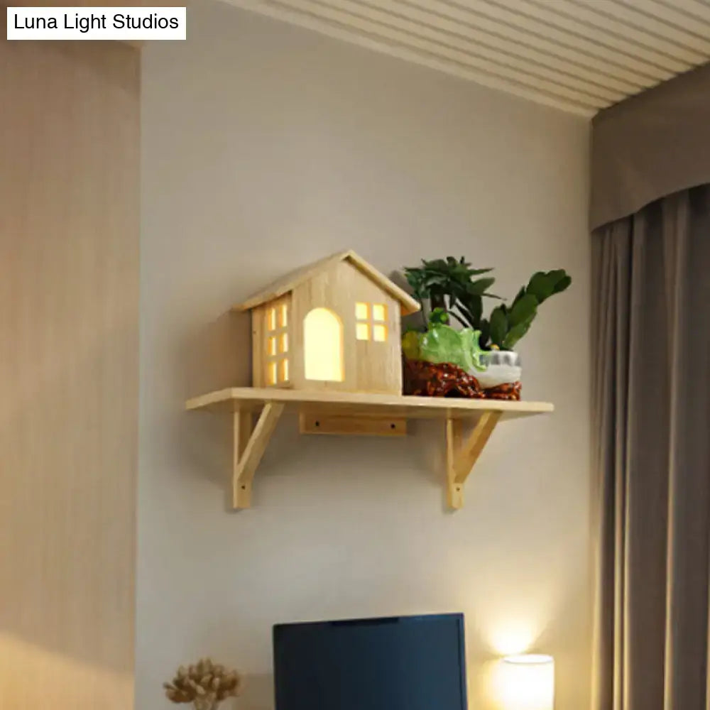 Beige wooden house wall sconce with storage shelf features warm white light and a small potted plant on top