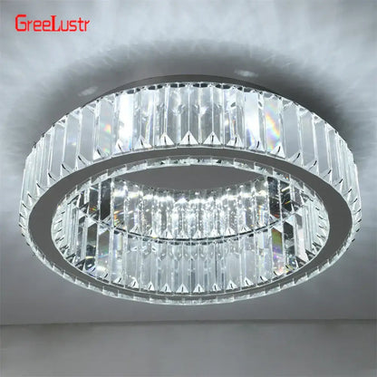 A modern silver metal big crystal round led dimmable chandelier with two rings of clear faceted crystals for living room decorbites