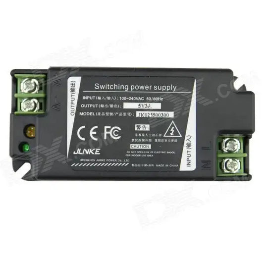 Black 15w led power supply adapter with green terminal blocks and white label displaying technical specifications