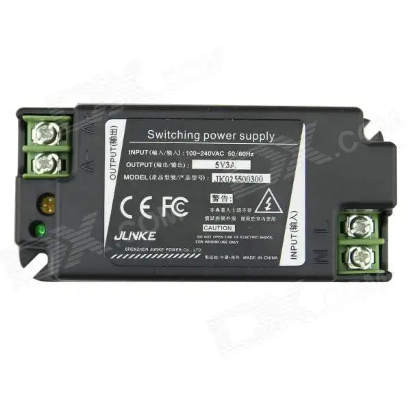 Black 15w led power supply adapter with green terminal blocks and white label displaying technical specifications
