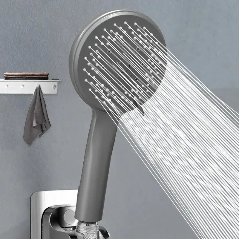 Modern matte gray black 5-mode adjustable high pressure shower head spraying water in a fine even stream