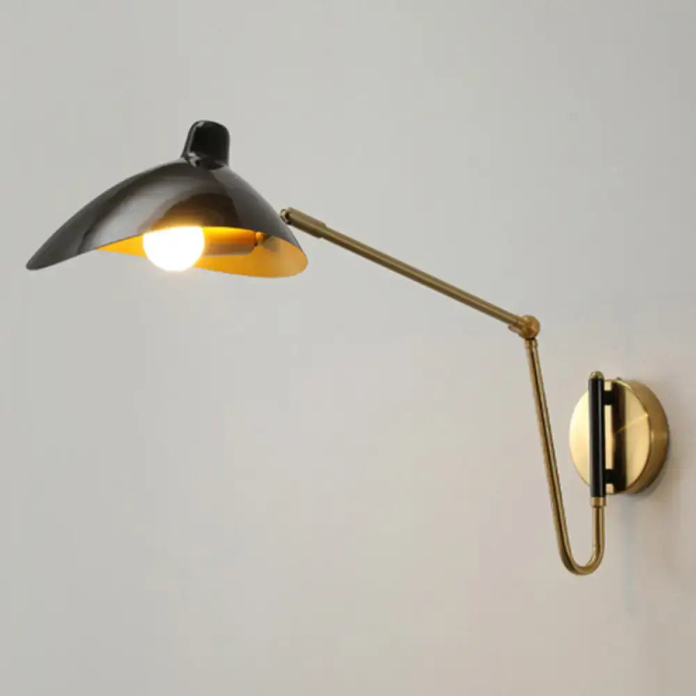 Black and brass wall lamp with adjustable joint and sleek curved arm duckbill reading light for bedroom use