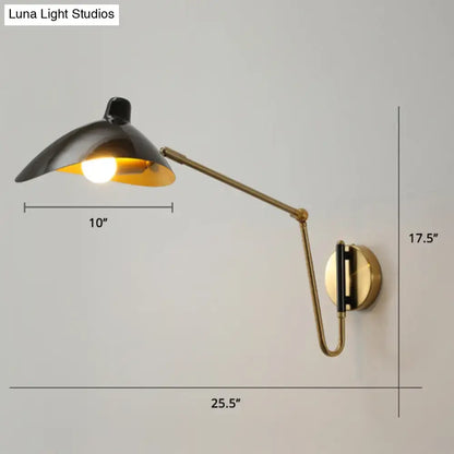 Black and brass duckbill reading light wall lamp with adjustable joint and sleek modern design for bedroom use