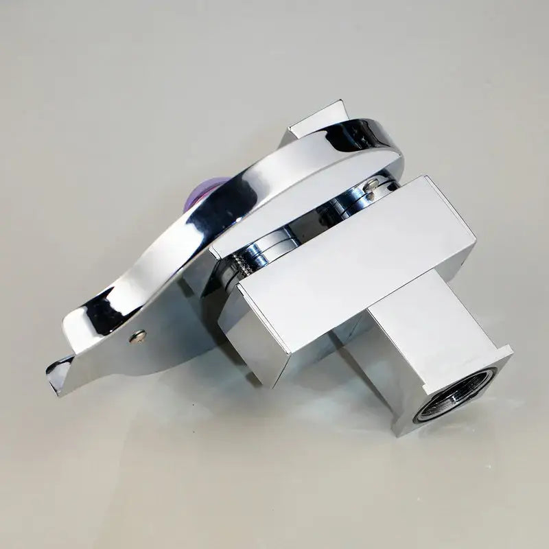 Modern chrome finished basin faucet with sleek angular design and purple-tinted handle decorbites brass led waterfall