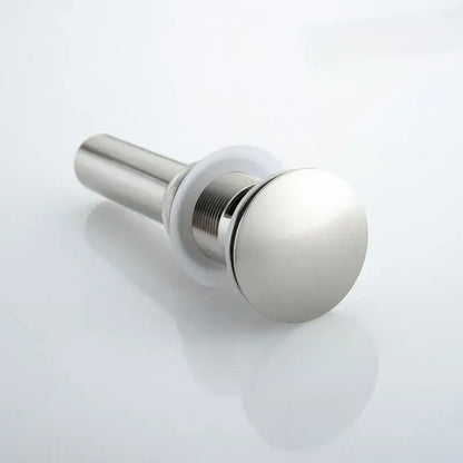 Shiny chrome-finished bathroom sink drain with brushed nickel stopper and threaded metal body for decorbites brushed nickel faucet