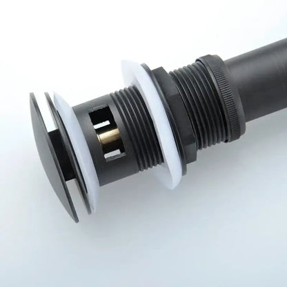 Black and chrome brushed nickel faucet sink drain stopper with black and white plastic and threaded metal connection