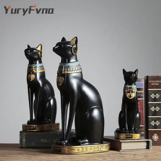 Three glossy black resin bastet cat goddess statues with gold turquoise detailing and heart pendant collars for decorbites decor