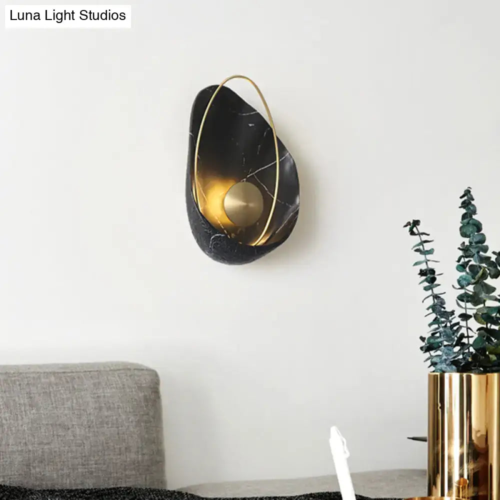 Black and gold marble wall light with circular fixture and metal accents for living room with 40w maximum bulb wattage