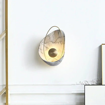 Modern wall light with beige gray marble-like body and gold frame supporting maximum bulb wattage 40w for living room use