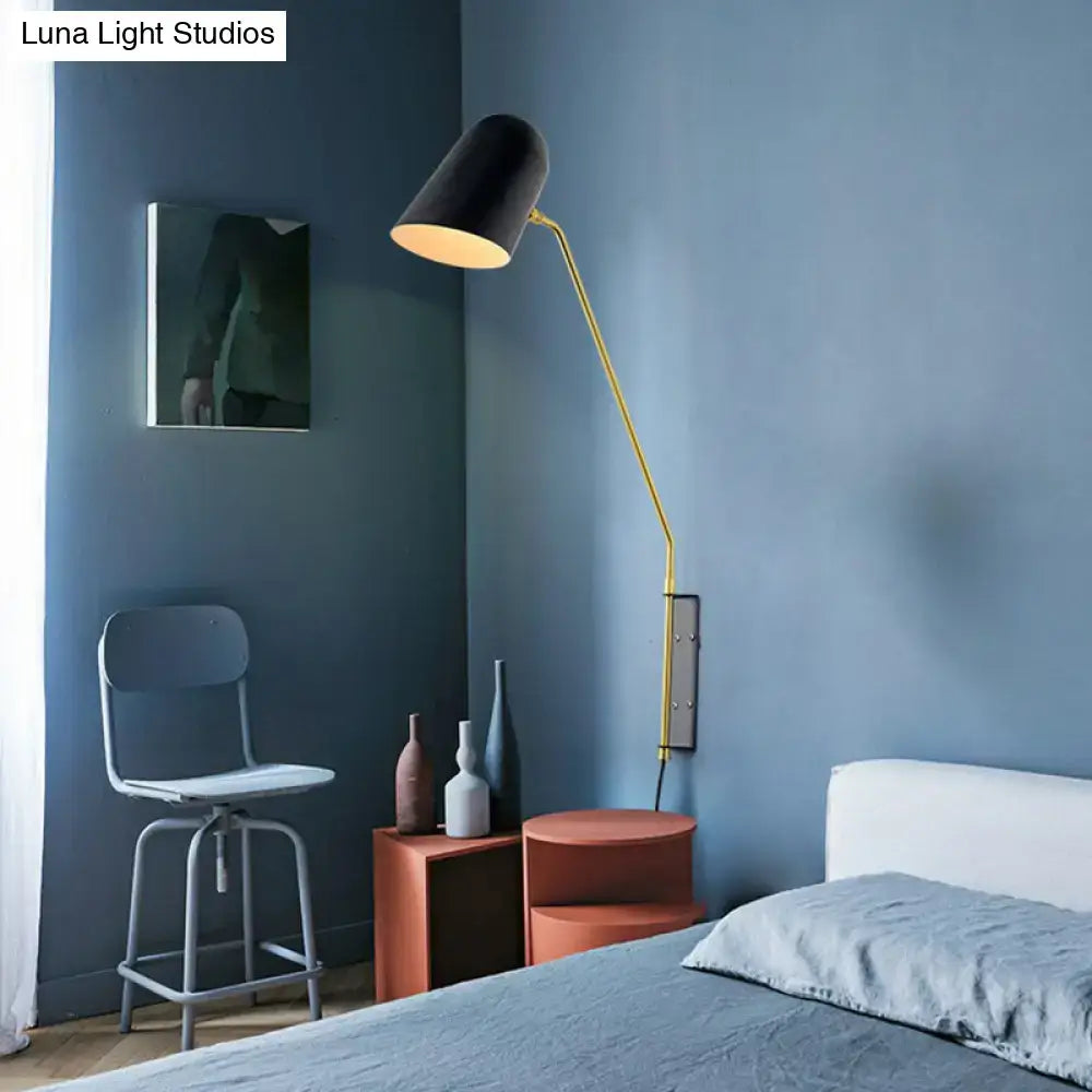 Black and gold adjustable reading light with metal shade designed as a modern bedroom wall sconce for led incandescent use