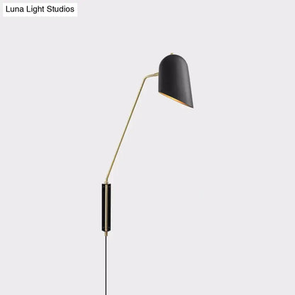 Black and gold reading light with metal shade and brass arm designed as a modern led incandescent fluorescent wall sconce