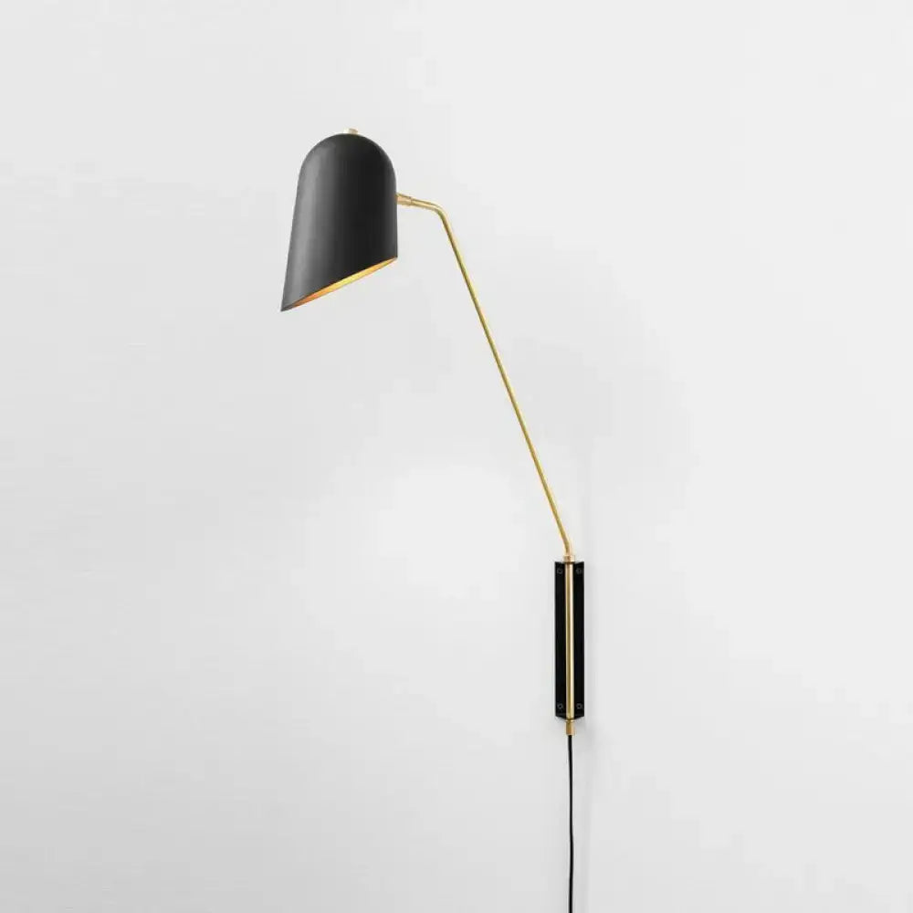 Black and gold reading light wall sconce with metal shade featuring a black matte finish and gold-toned articulated arm