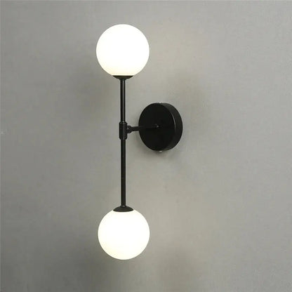 Black metal wall lamp with two frosted glass globes from decorbites golden glass led bedroom sconce collection