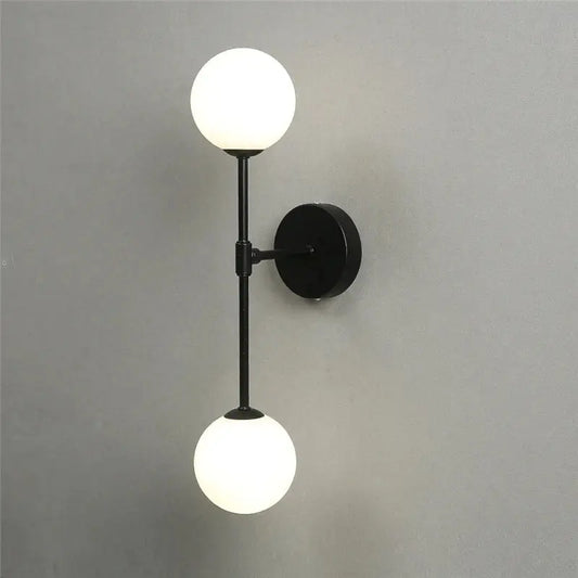 Black metal wall lamp with two frosted golden glass led globes for bedroom decorbites golden glass sconce